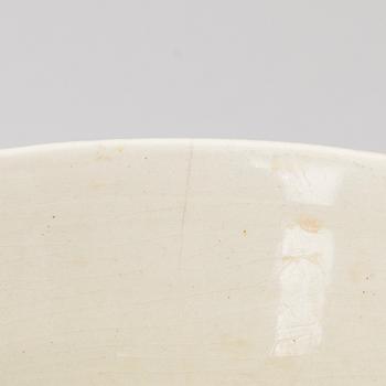 A ceramic bowl signed GT.
