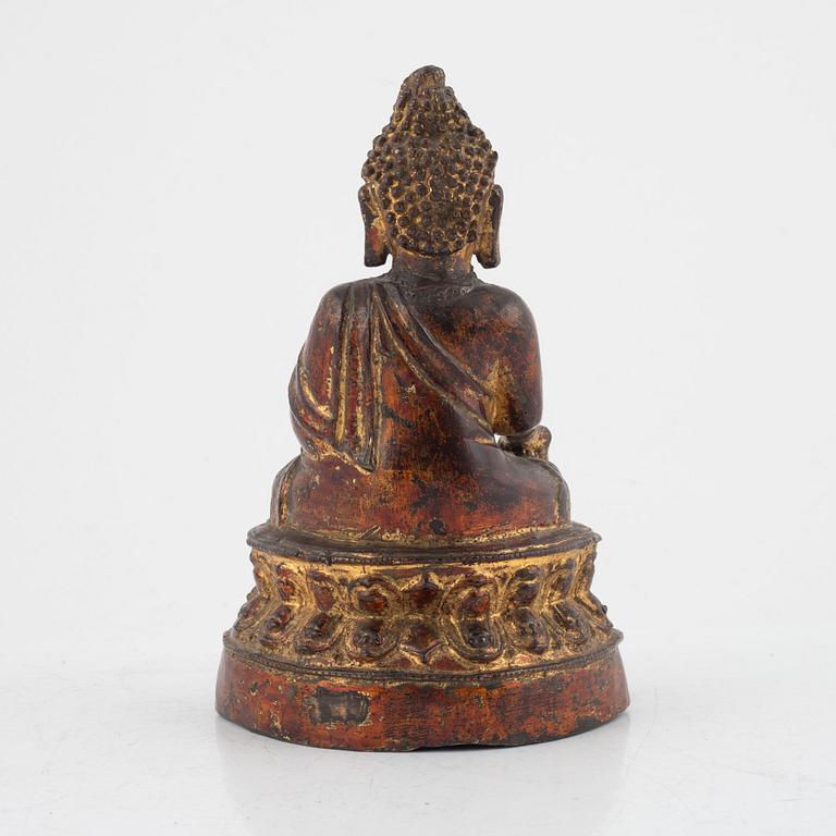 A seated bronze figure of Buddha, probably late Ming dynasty (1368-1644).
