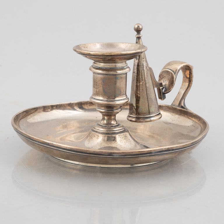 A silver chamber candlestick with mark of R & S Garrard & Co, London, England 1848.