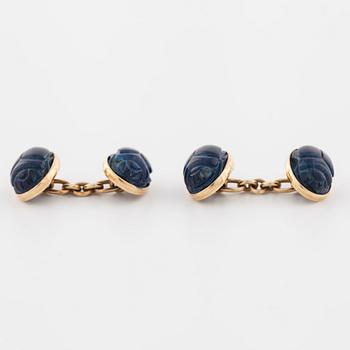 A pair of carved lapis lazuli cufflinks.
