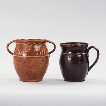 two earthenware pots from the 19th century.