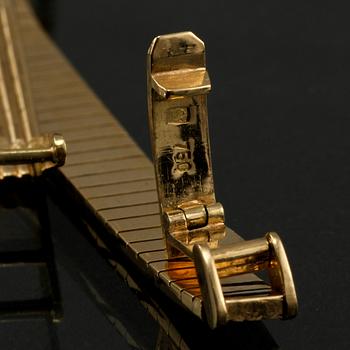 DAMARMBANDSUR, 18k guld, Tissot. Vikt 27 g.