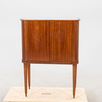 A 1950s mahogany bar cabinet.