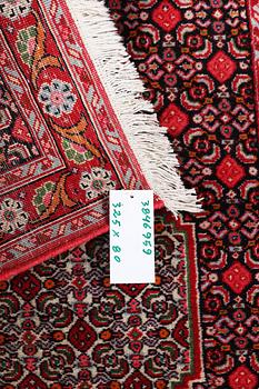 A Runner carpet, Senneh, c. 325 x 80 cm.