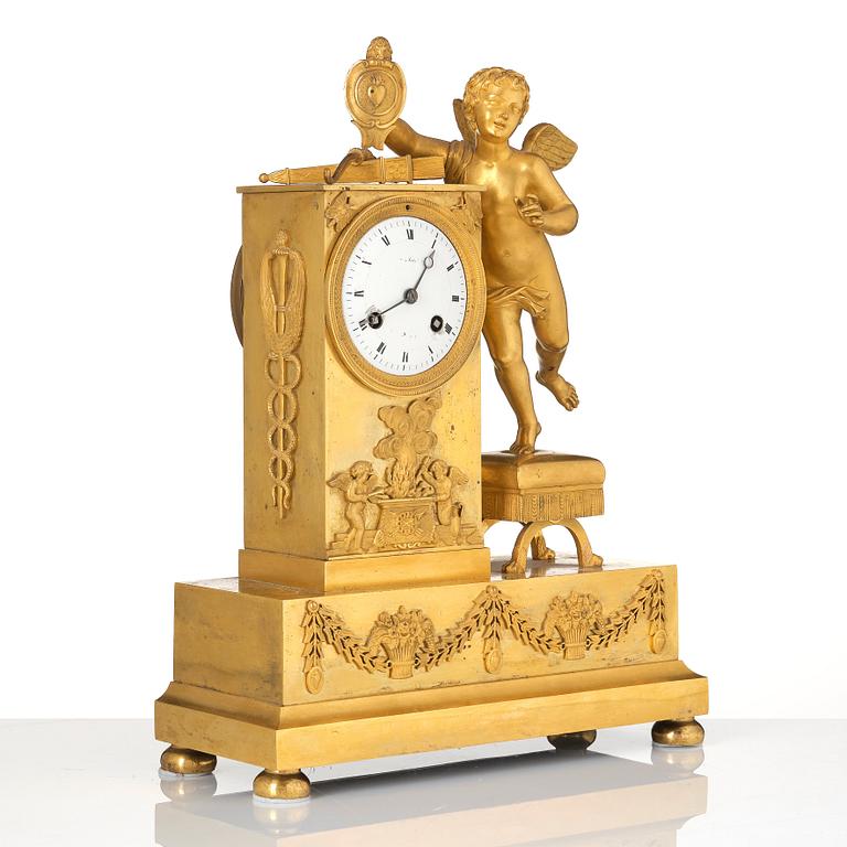 An Empire ormolu figural mantel clock, early 19th century.