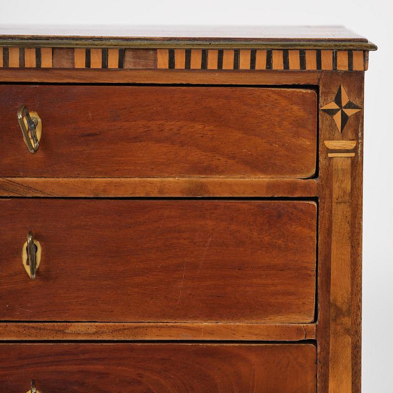 A Northern European mahogany miniature commode, early 19th century.