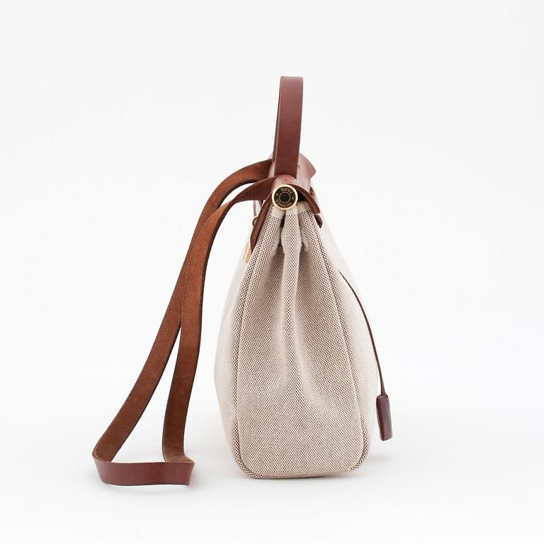 HERMÈS, a canvas and leather bag in two parts, "Herbag".