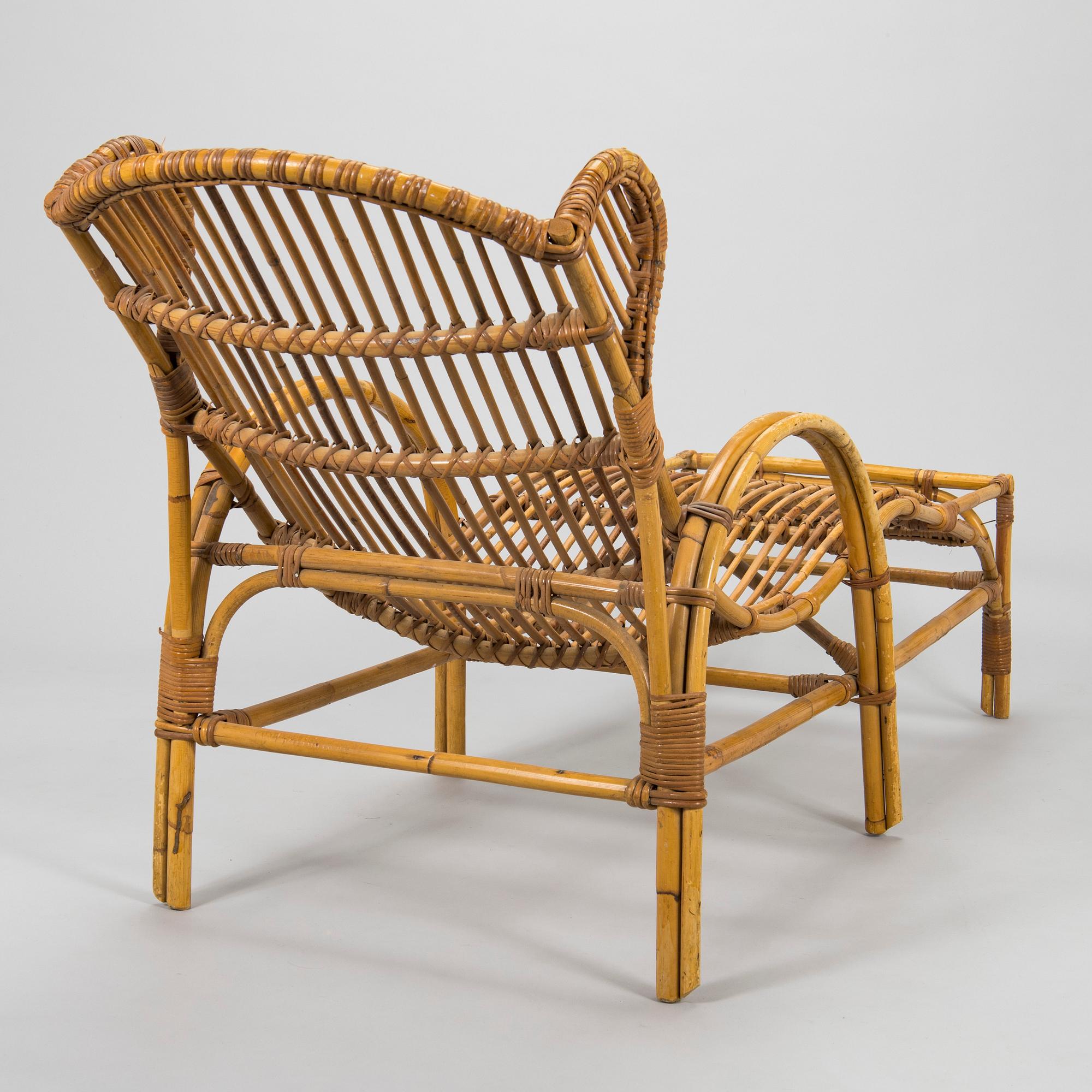 A mid-20th century rattan lounge chair.