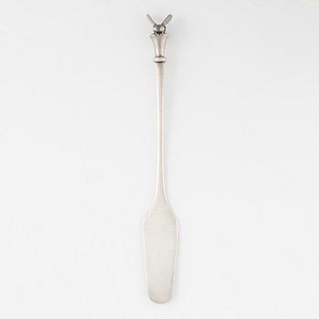 A silver honey spoon designed by Barbro Littmarck for W.A Bolin, Stockholm 1965.