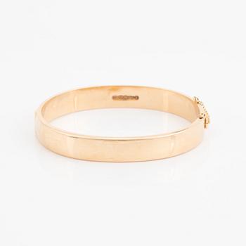 A 14K gold bracelet.