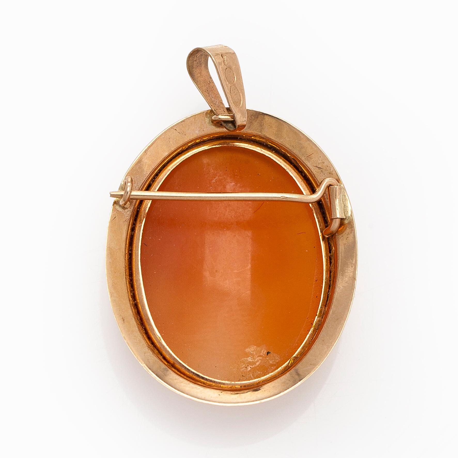 A 14K gold and shell cameo jewelry set, bracelet, pendant/brooch and ring.