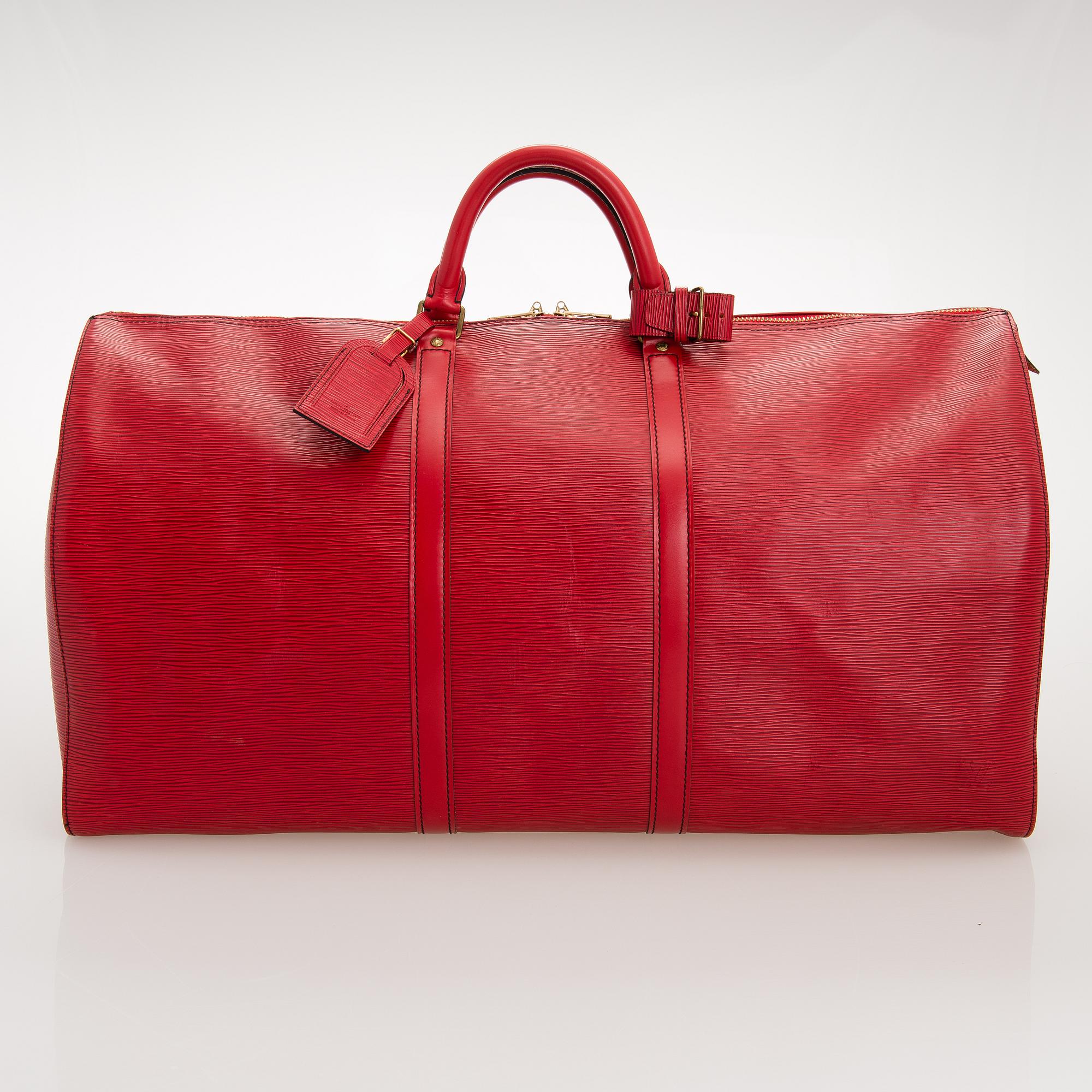 A RED EPI LEATHER KEEPALL TRAVEL BAG.