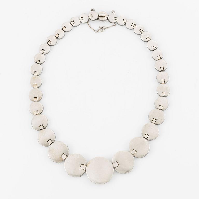 A silver necklace.