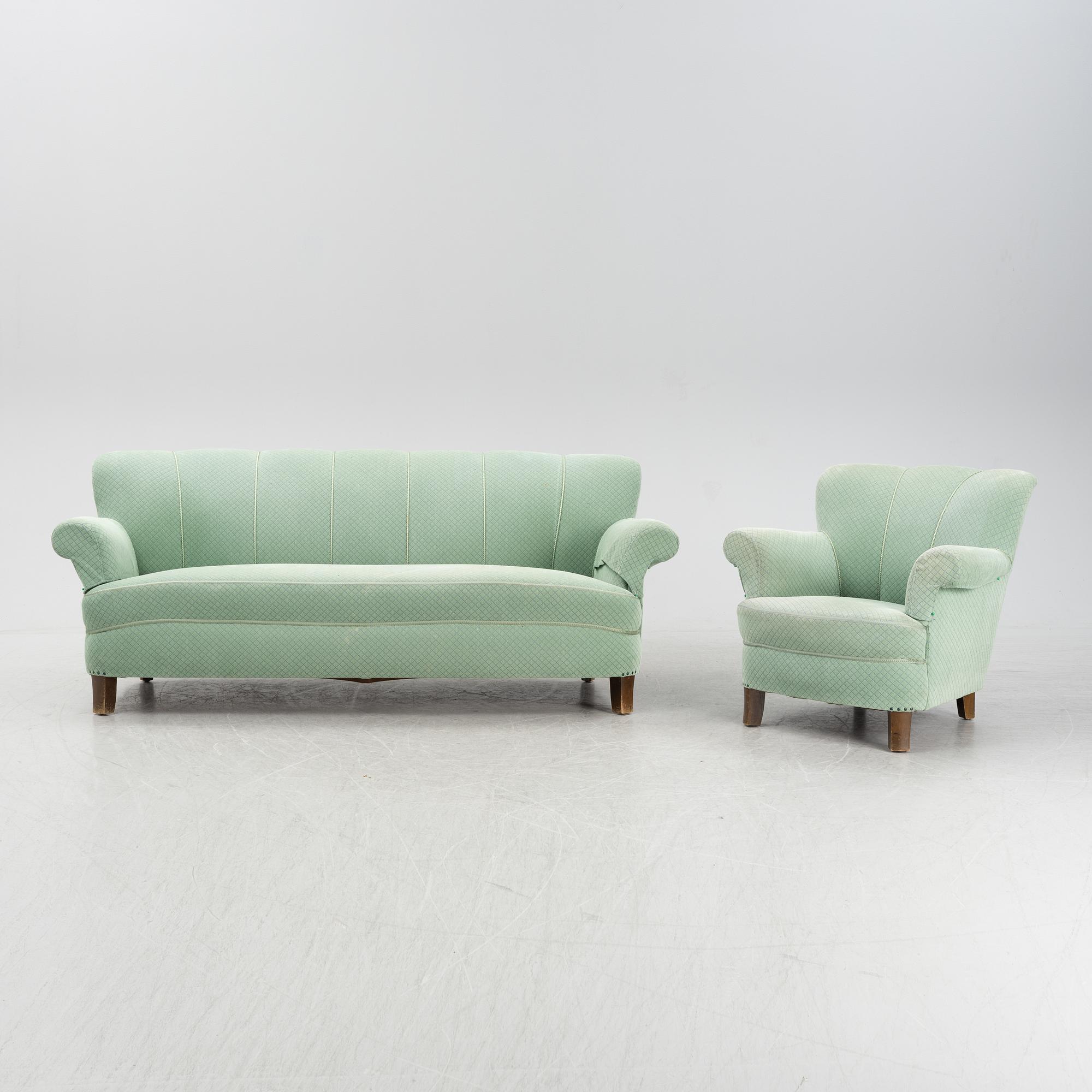 A mid 20th Century sofa and easy chair.