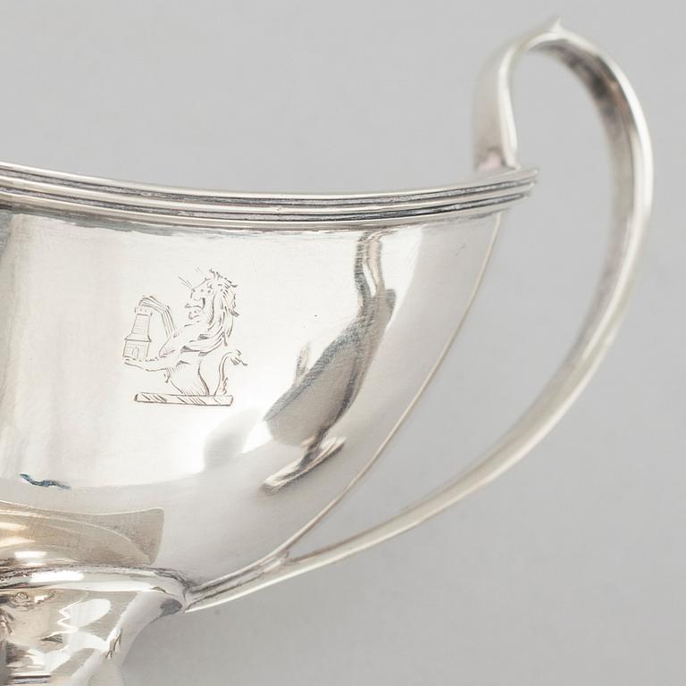 HOLLAND, SON & SLATER, a pair of silver salt cellars, London, 1883.