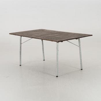 A GARDEN TABLE AND FOUR ARMCHAIRS FORM GRYTHYTTAN.