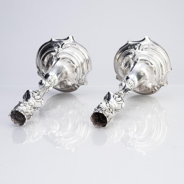 A pair of Swedish Rococo silver candlesticks, marks of Abraham Lundberg, Stockholm 1765.