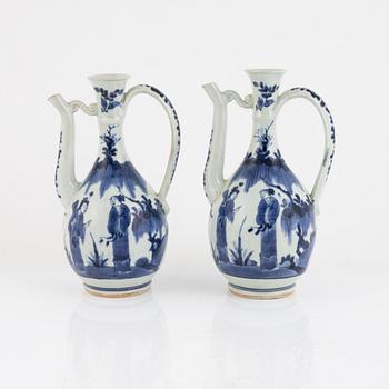 A pair of Japenese blue and white ewers, probably Meiji (1868-1912).