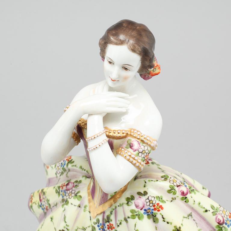 A porcelain figurine by Aelteste Volkstedter Porzellanmanufaktur in Rudolfstadt, made around year 1900.