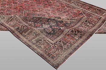 An oriental, vintage design carpet, c. 404 x 301 cm.