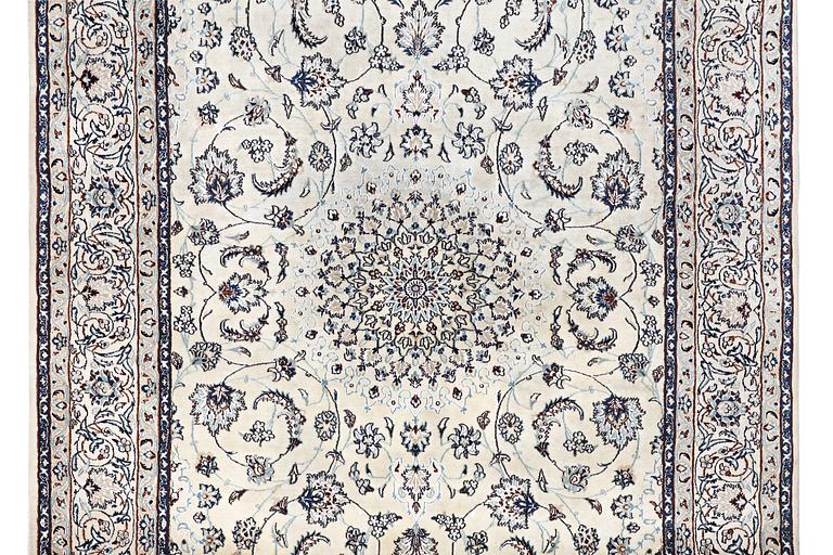A Nain carpet, part silk, c. 294 x 193 cm.