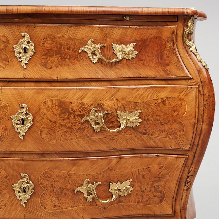 A burr-alder and gilt brass-mounted rococo commode by J. Sjölin (master 1767-85).