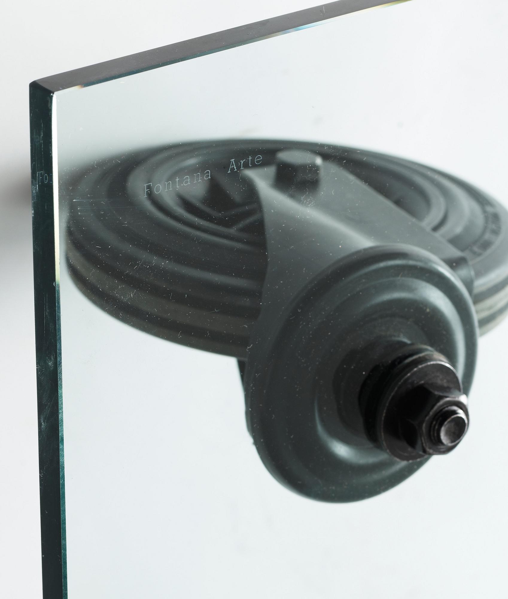 A Gae Aulenti 'Tavola con Ruote' table, Fontana Arte, Italy.