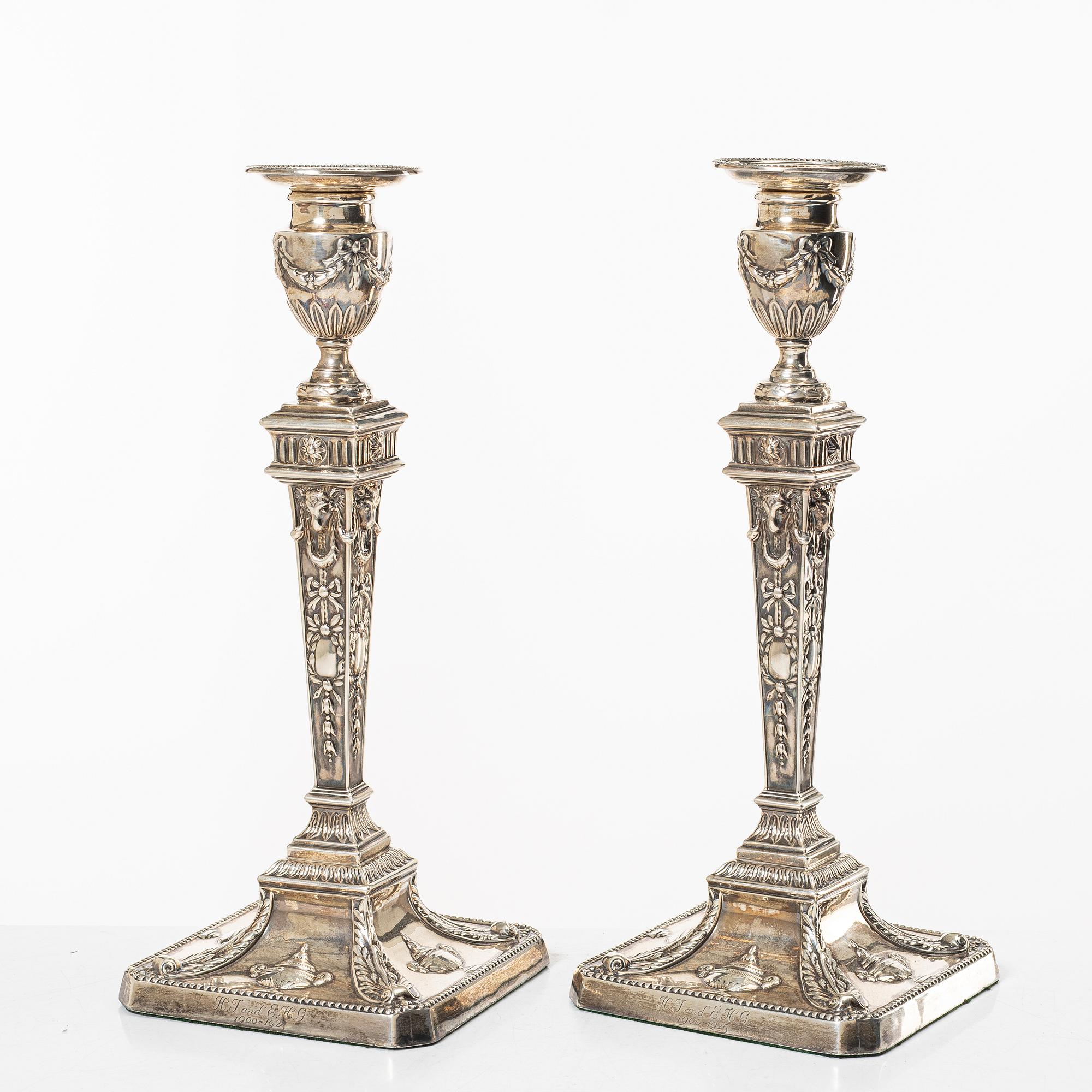 A pair of English silver candlesticks, mark of William Hutton & Sons Ltd, London 1902.