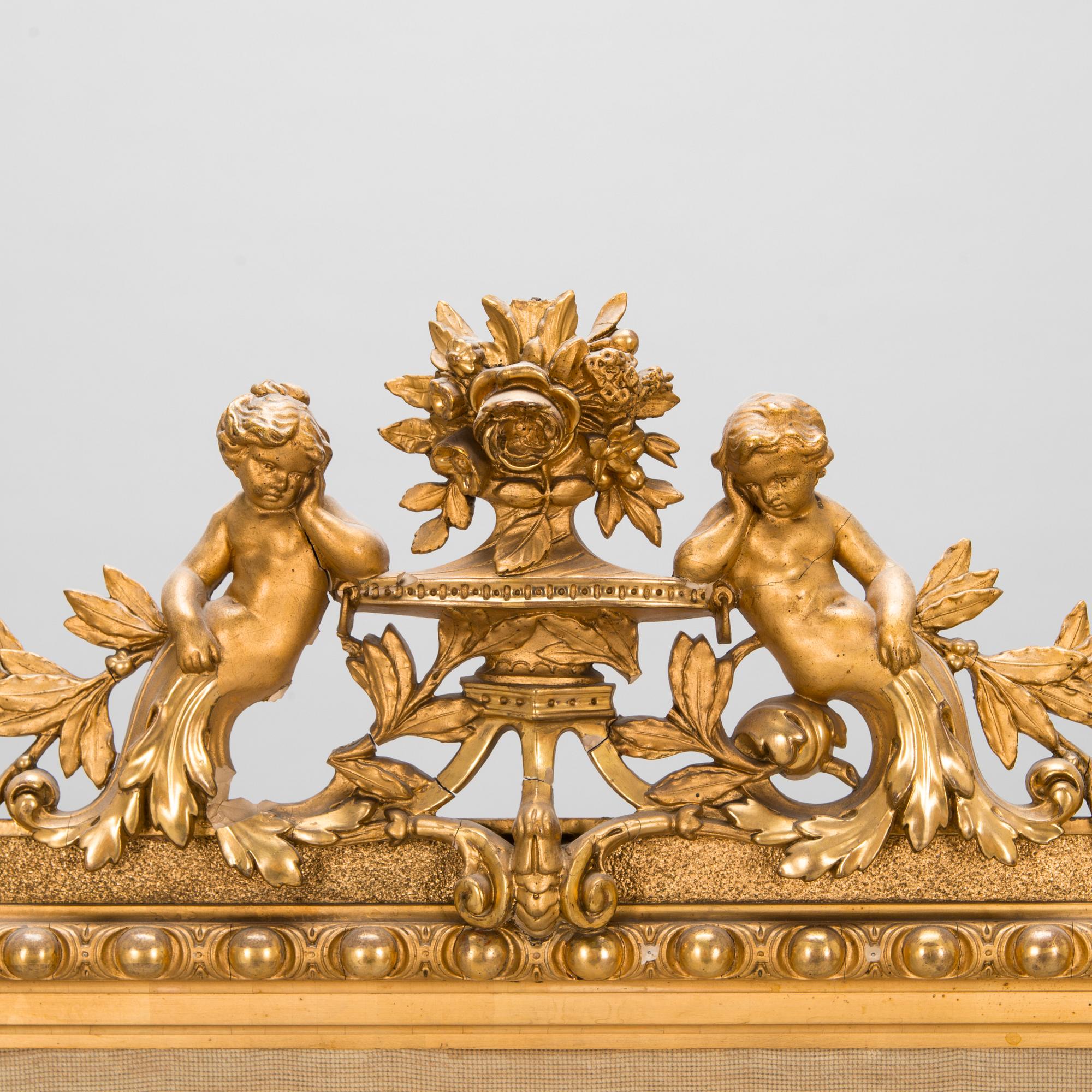 A late 19th century fire screen.