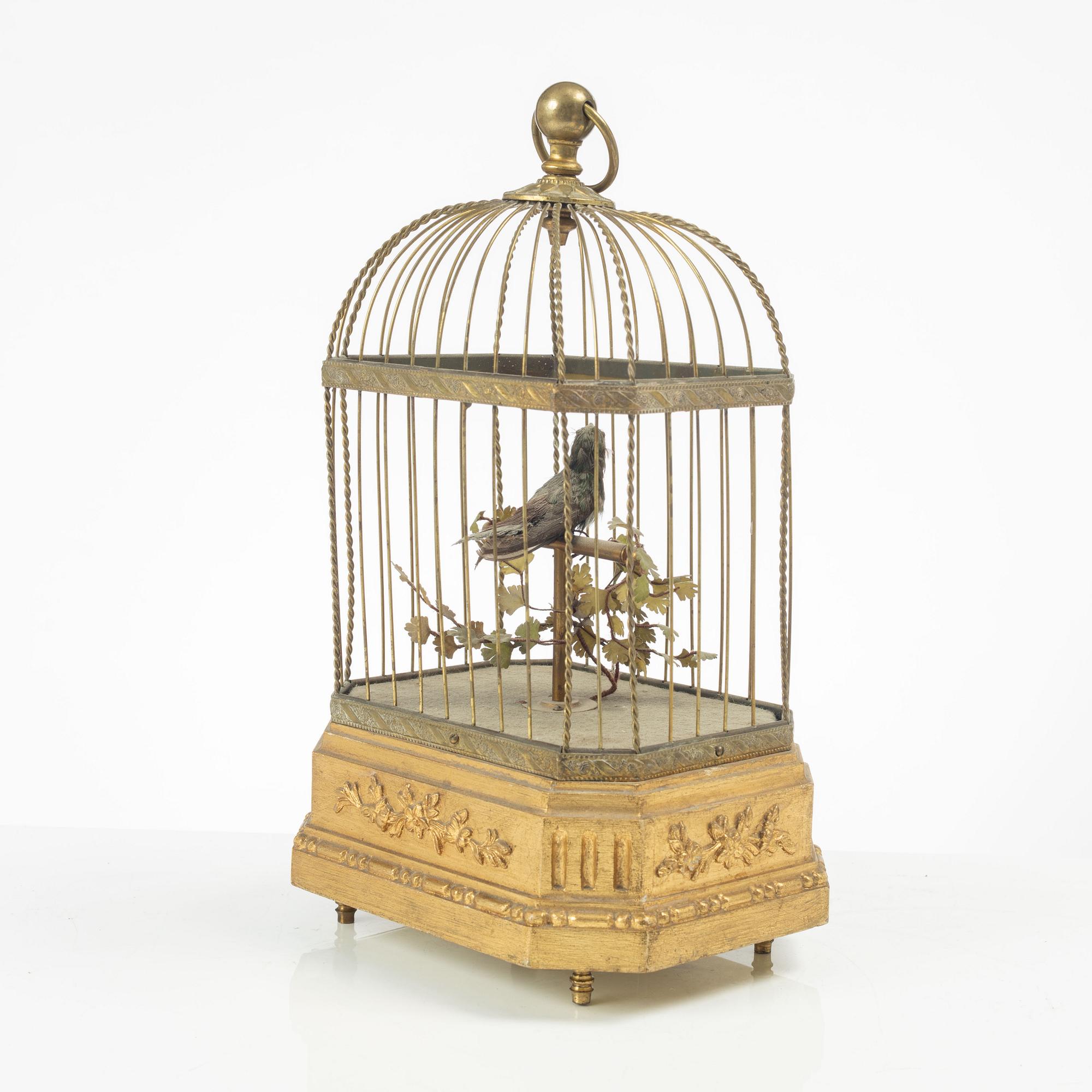 A music box in the shape of a bird's cage, France, late 19th century.