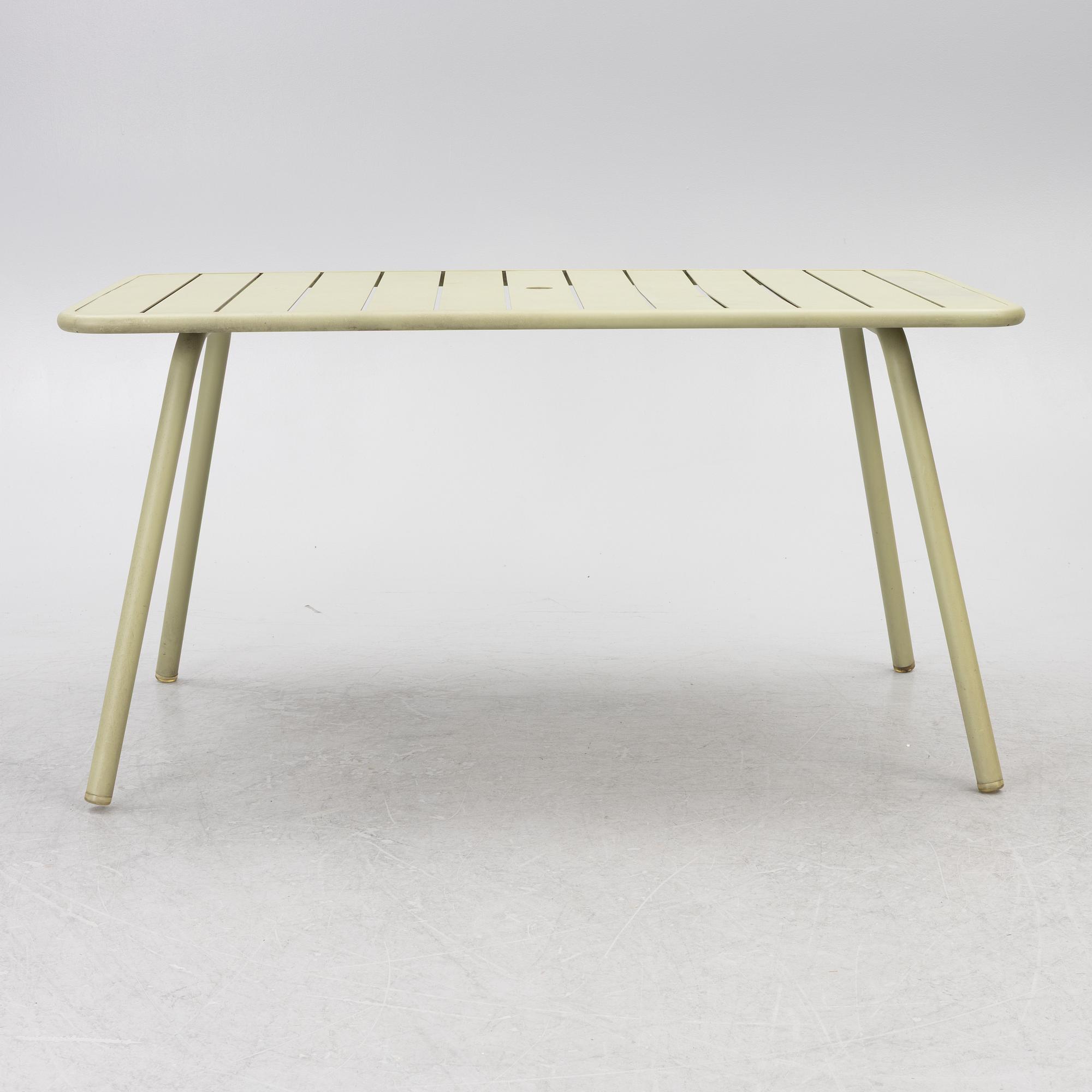 Frédéric Sofia, a table and two chairs for outdoor use, "Luxembourg" Fermob, France, 21st century.