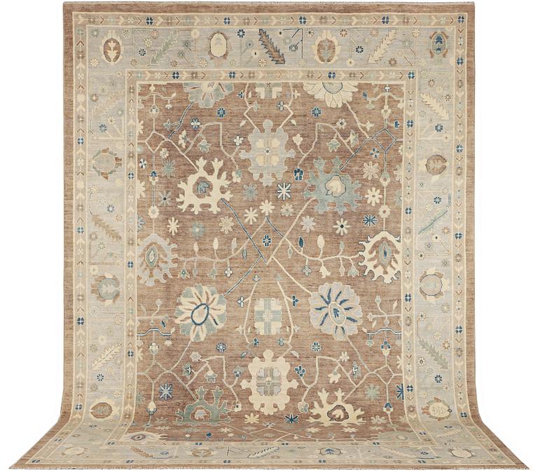 An Ushak design carpet, a. 423 x 305 cm.