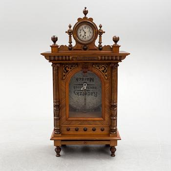 Polyphone with clock in walnut case, late 19th Century.