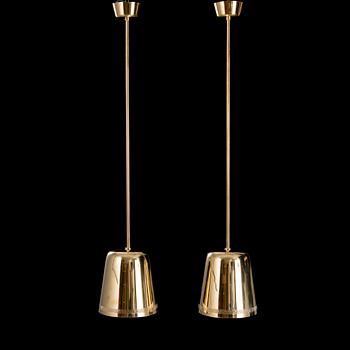 A pair of 1950s/60s pendant lights for Taito, Finland.