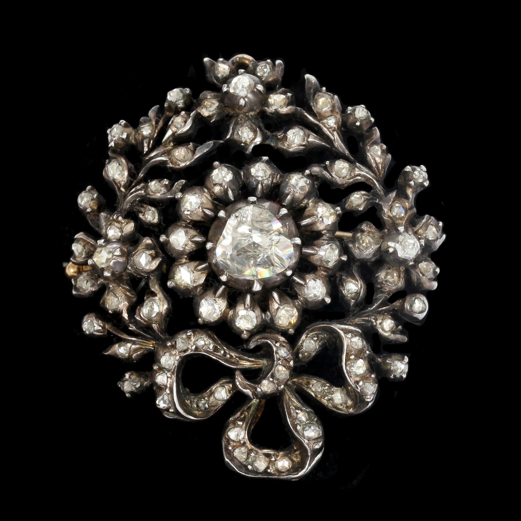 Brosch, delvis förgyllt silver med bla. fasettslipade diamanter tot ca 0,80 ct. Vikt 12,8 g.