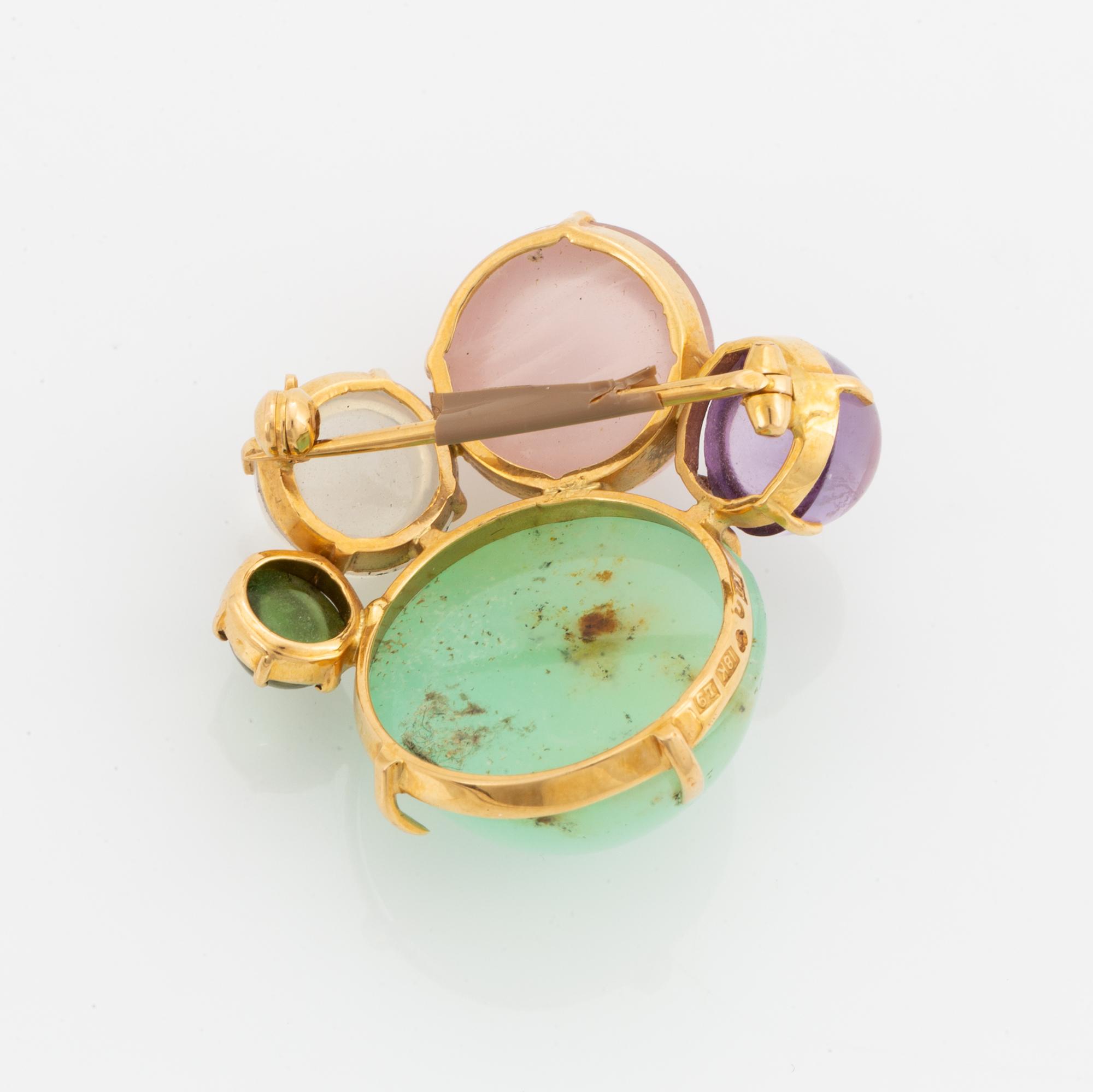 Brosch, guld med  cabochonslipade färgstenar.