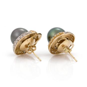 A pair of cultured tahiti pearl earrings with brilliant cut diamond jackets.