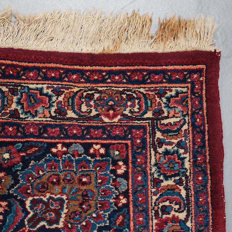 A CARPET, a semi-antique Mashad, ca 400-404 x 314 cm.