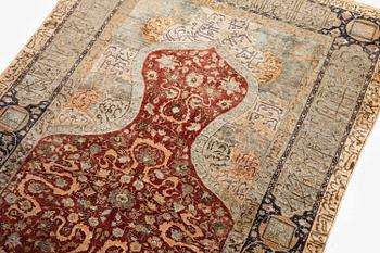 An antique silk rug, probably Istanbul, Turkey, c. 181 x 127 cm.