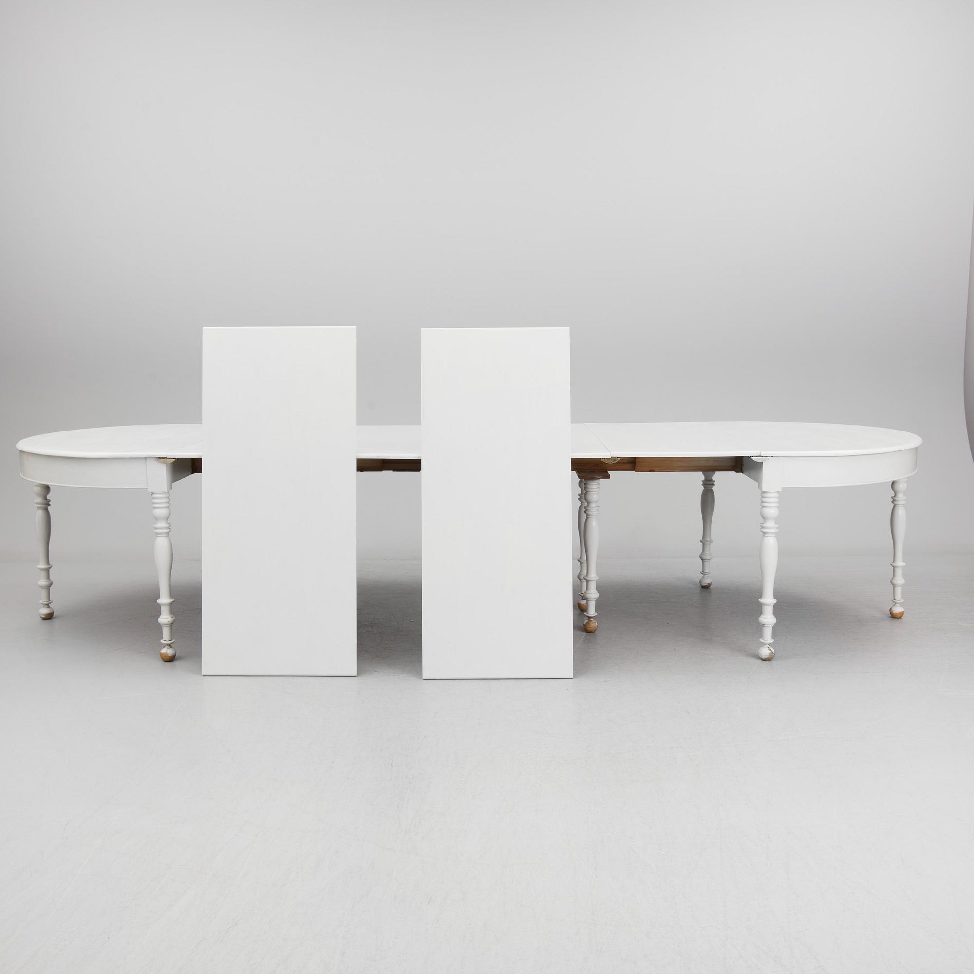 A mid 19th century dining table with six extension leaves.