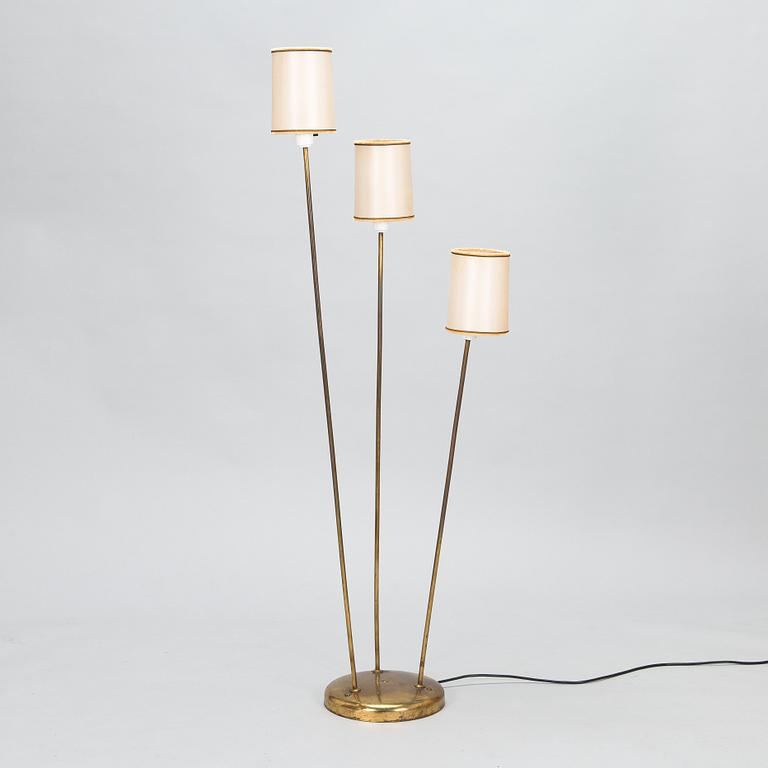 A mid-20th-century three-light floor lamp.