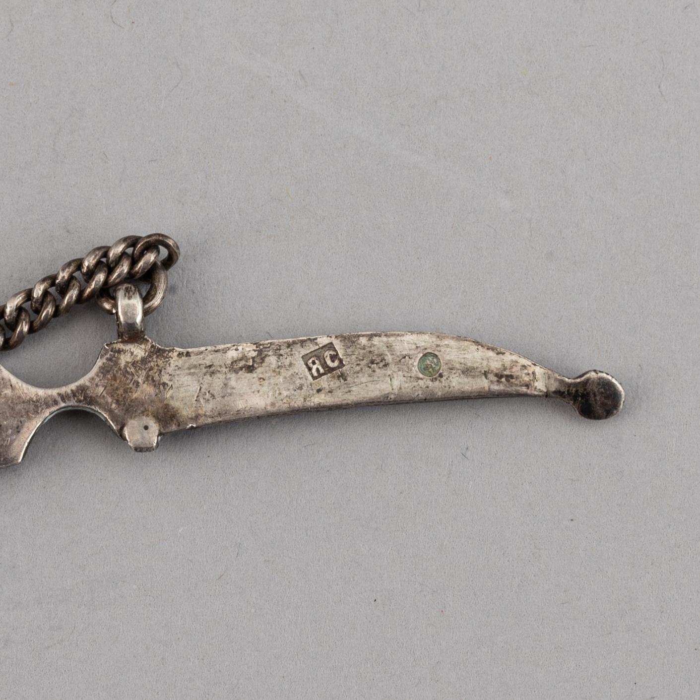 A Russian silver and niello bracelet and two belt buckles, unidentified makers mark, Kiev 1896-1908 and other.