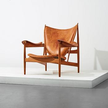 Finn Juhl, a teak and natural brown leather "Chieftain Chair" by Niels Vodder, 1950-60's.