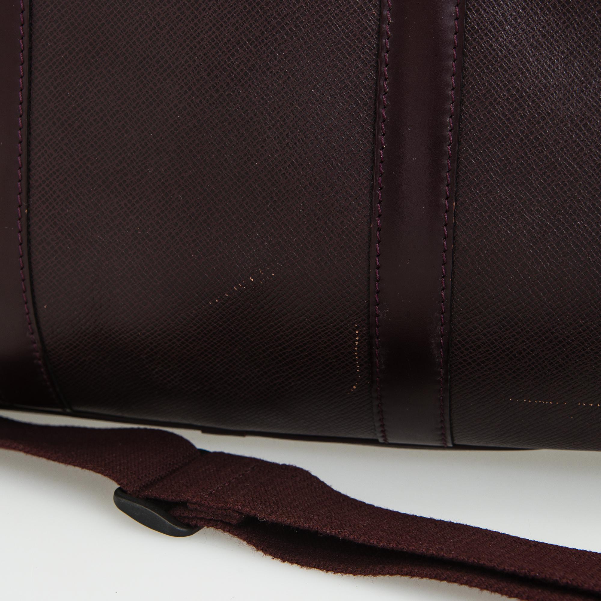 Louis Vuitton, a 'Taiga Kendall PM' weekend bag.