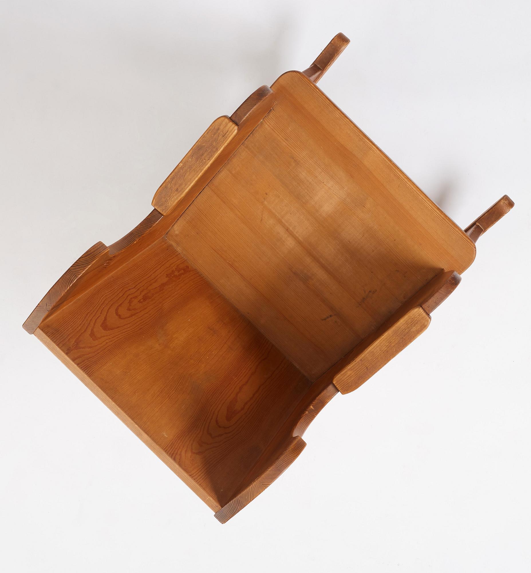 Nordiska Kompaniet, a Swedish Modern stained pine 'Lovö' rocking chair.