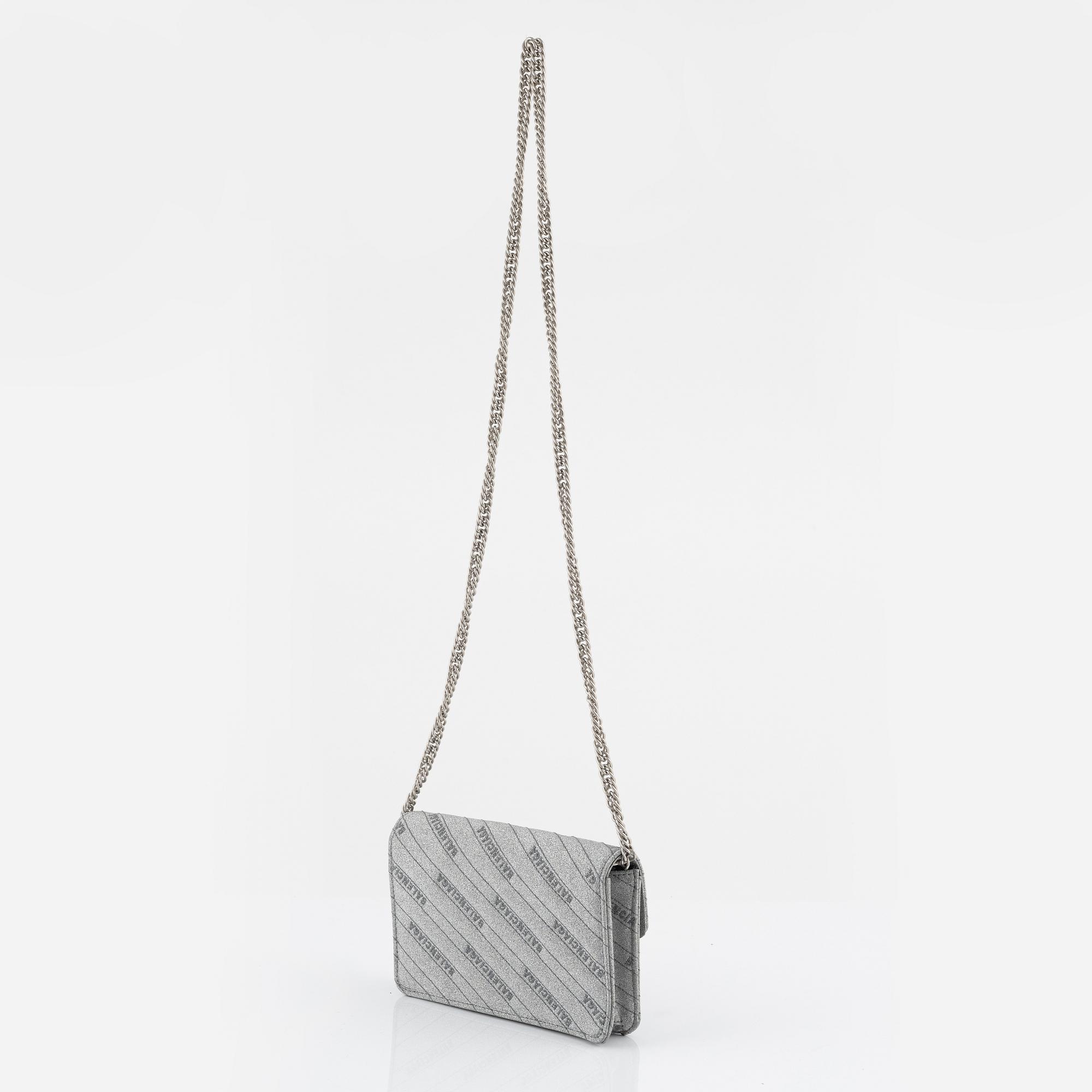 Balenciaga, a 'BB Round glitter bag'.