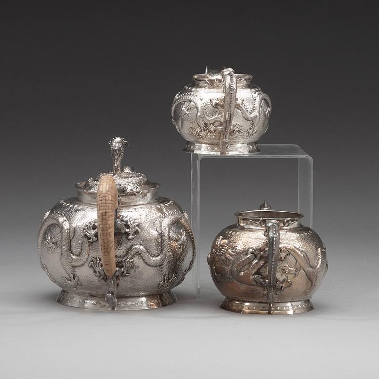 A Chinese three piece silver tea set, early 20th Century.