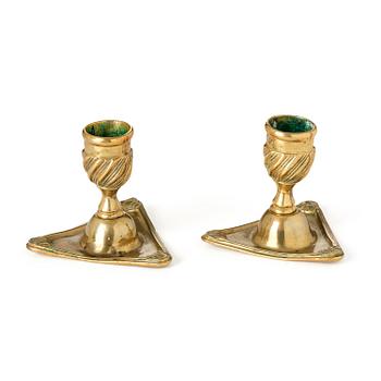 127. A pair of rococo brass candlesticks by Petter Hemming (master in Stockholm 1771-1807), 1772.