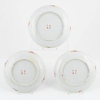 A set of three famille rose plates, Qing dynasty, circa 1900.
