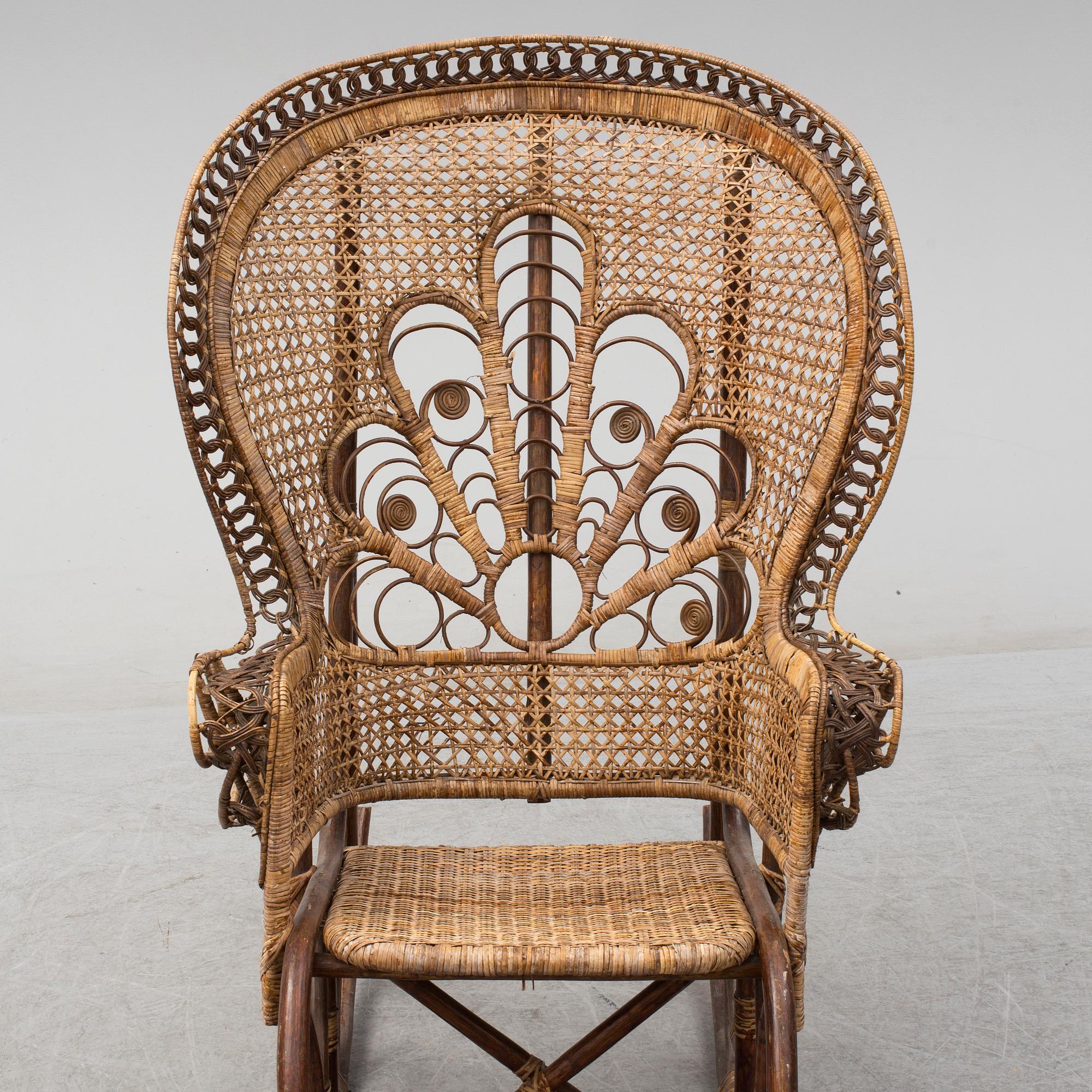 A circa 1900 rattan rocking chair. Bukowskis